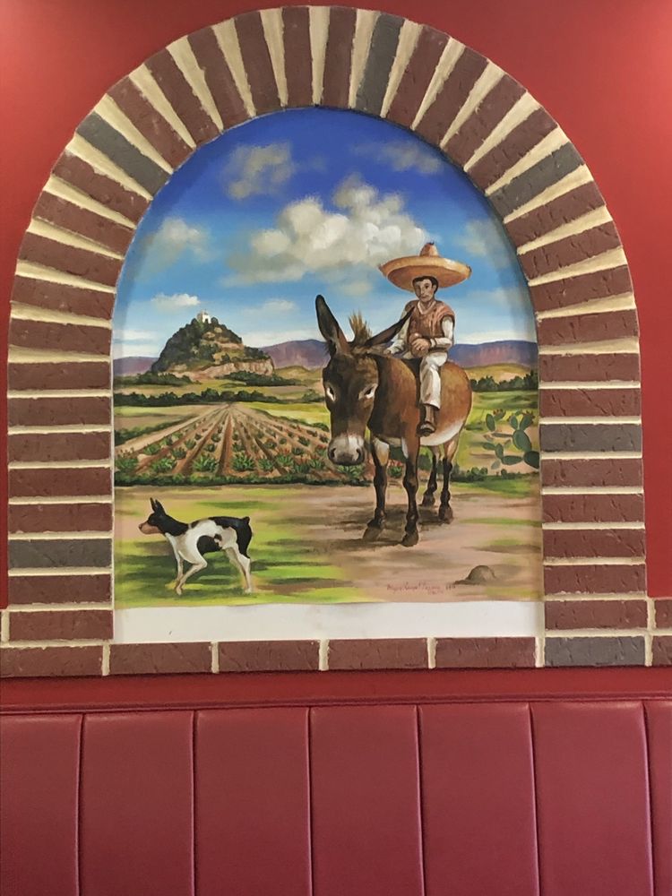 Hand-painted countryside mural inside Taquitos Mexico